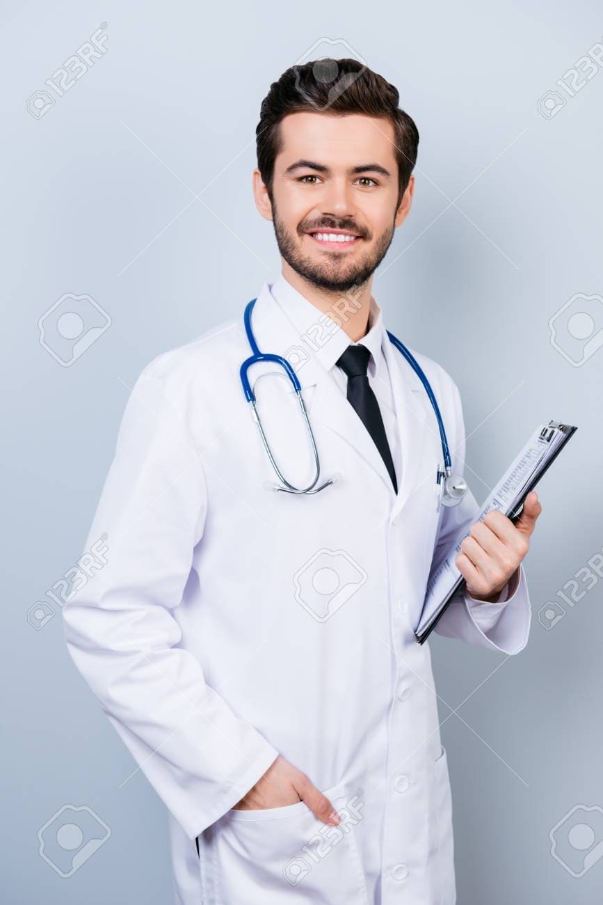 Doctor completing on medical card. Isolated on a white.